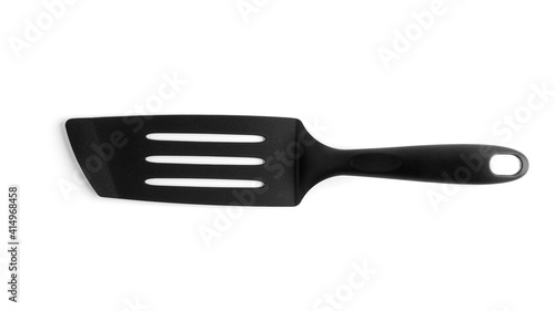 Black plastic kitchen spatula isolated on white background,