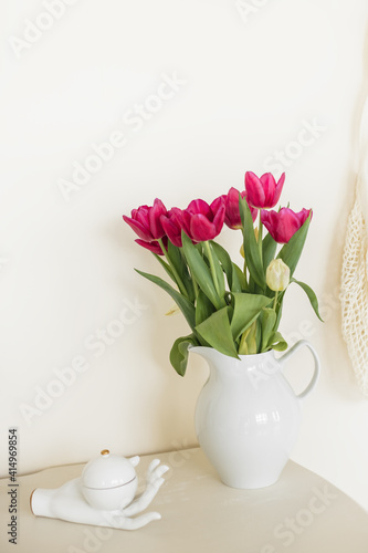 bouquet of pink tulips in a white room