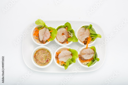 Spicy salad Shrimp in fish sauce and herb and Spicy Sauce Seafood dipping chili hot and spicy dish on White Background