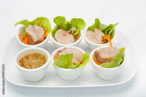 Spicy salad Shrimp in fish sauce and herb and Spicy Sauce Seafood dipping chili hot and spicy dish on White Background