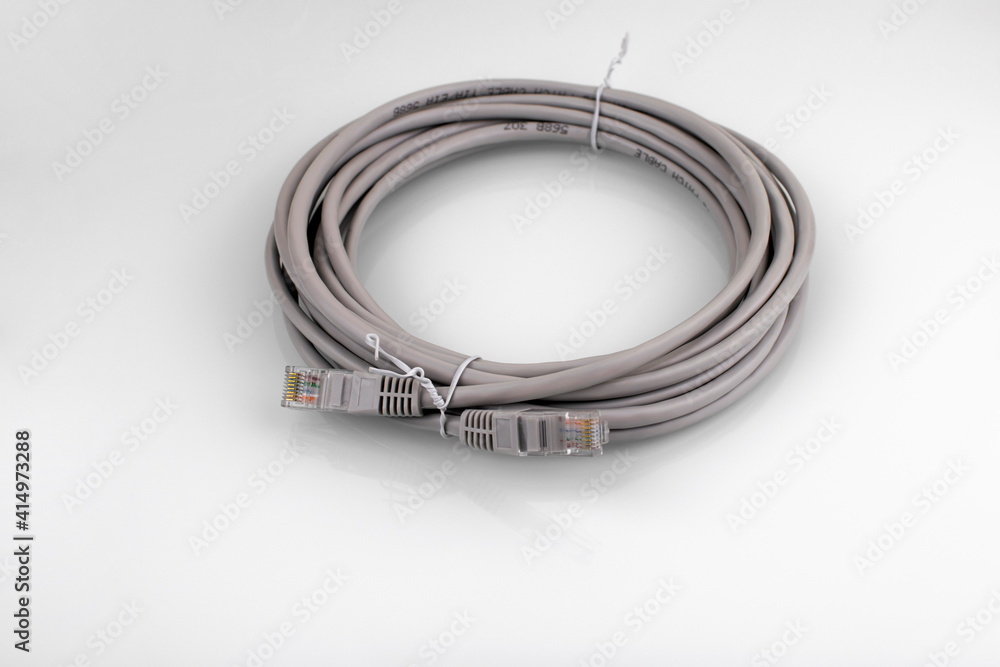 Fototapeta premium Internet cable on a white background. Connecting a computer to a network or LAN