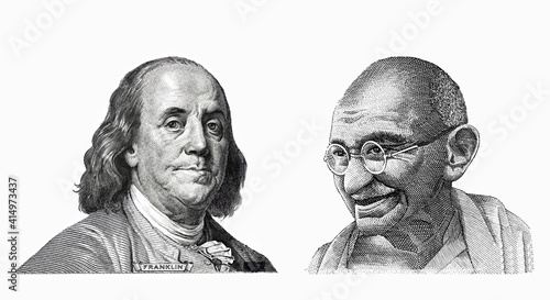 Benjamin Franklin cut on new 100 dollars banknote and Mahatma Gandhi cut on old 10 Indian rupee photo