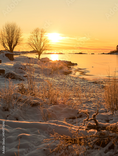 sunset over the lake in winter