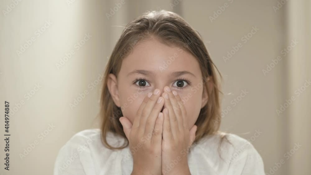 Surprised and shocked child girl face. Portrait expression little kid with brown-eyed looking at camera closeup. Wow emotion. Surprised and shocked child girl face. Portrait expression little kid with brown-eyed looking at camera closeup. Wow emotion.