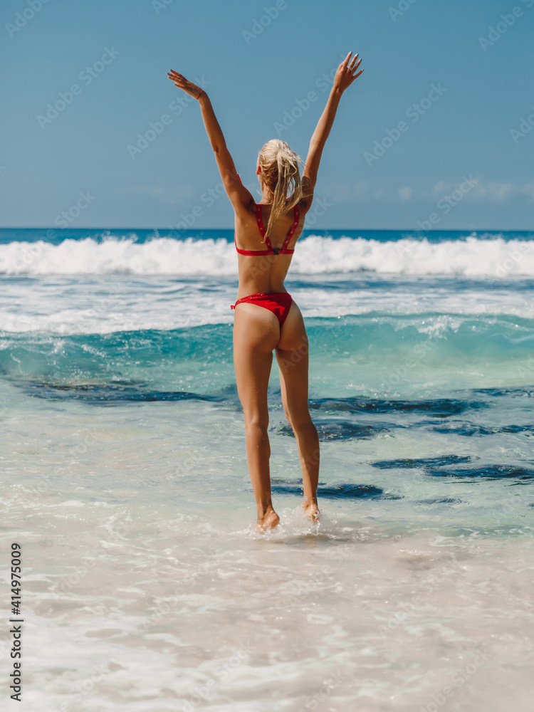 Attractive happy woman in swimwear enjoy summer at beach
