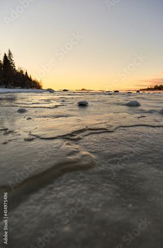 Frozen lake ice surface at sundown © imagemanufaktur