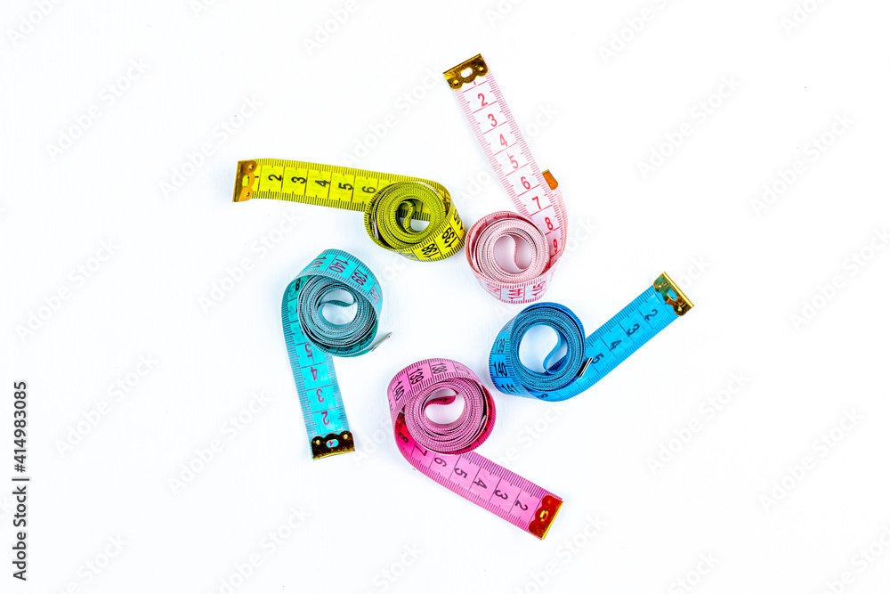 five bright centimeters forming a spiral on white background five bright centimeters forming a spiral on white background