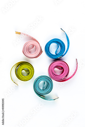 five bright centimeters forming a spiral on white background