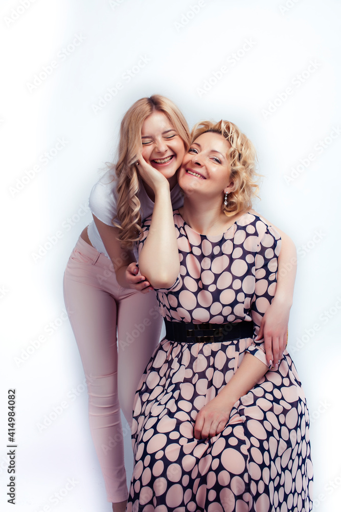 mother with teen daughter together posing happy smiling isolated on white background with copyspace, lifestyle people concept mother with teen daughter together posing happy smiling isolated on white background with copyspace, lifestyle people concept