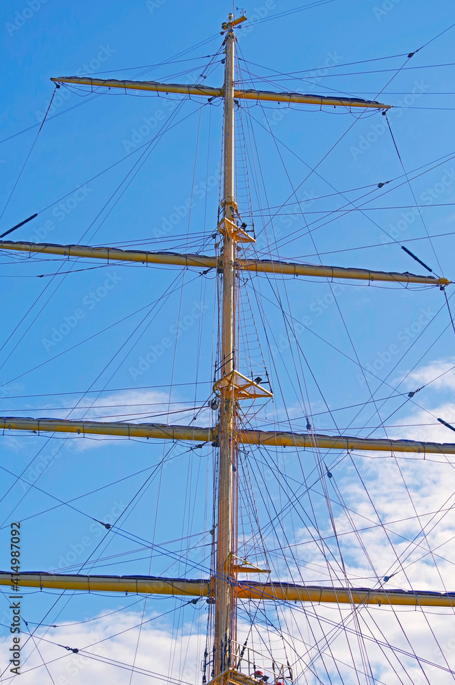 Masts and rigging of a sailing ship against sky Masts and rigging of a sailing ship against sky