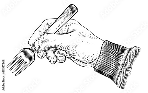 A hand holding a fork for eating food in a vintage retro engraved or etched woodcut print style