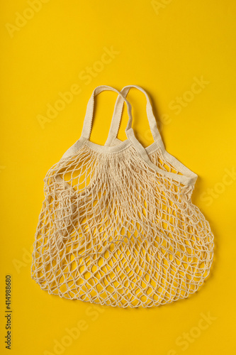 Eco-friendly bag on yellow background