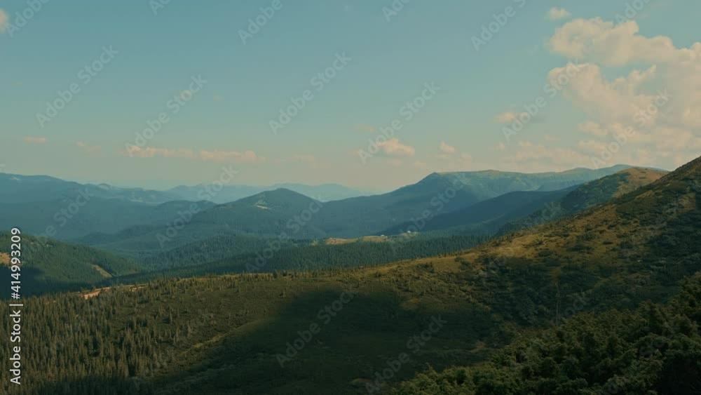 Aerial view of beautiful mountains landscape, green trees forest. Flying over meadow, valley, country fields, peaks, cliffs, rocks, rising over horizon. Traveling outdoors, hiking, exploring nature. Aerial view of beautiful mountains landscape, green trees forest. Flying over meadow, valley, country fields, peaks, cliffs, rocks, rising over horizon. Traveling outdoors, hiking, exploring nature.
