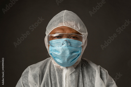 Asian Male wearing Personal protective equipment Suit