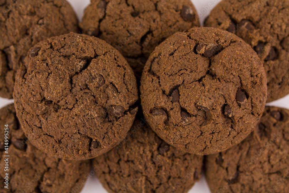 chocolate chip cookies with chocolate pieces on white background chocolate chip cookies with chocolate pieces on white background
