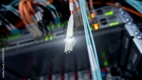 Glowing Optical Cable in Data Center.
