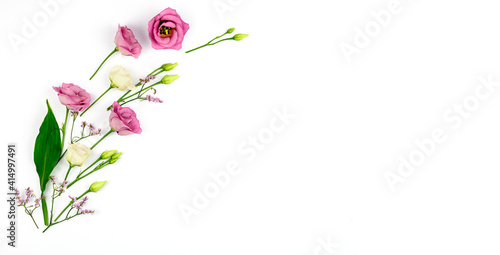 Spring composition. Flowers, paper blank white background. Flat lay, top view, copy space, mock up.