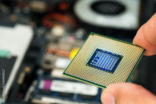 Photography Man hand holding CPU, processor close-up for PC computer and notebook, separate CPU macro image , electrical circuit