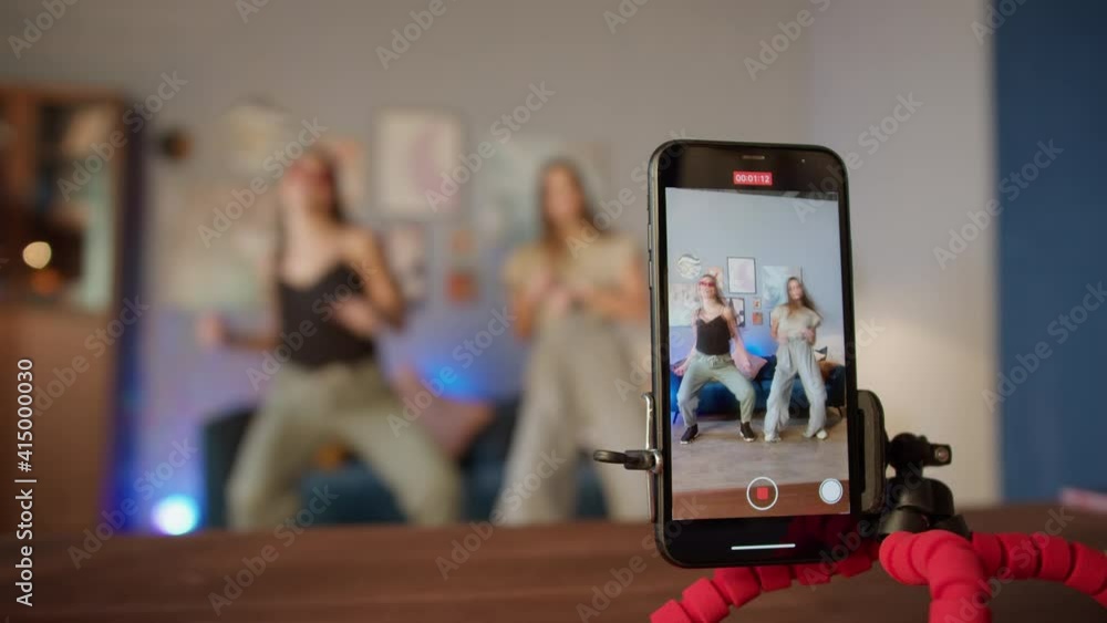 Teenagers womans shooting together dancing at home when making video for social media, stories hip hop popular trandy dance, students at home make content Teenagers womans shooting together dancing at home when making video for social media, stories hip hop popular trandy dance, students at home make content