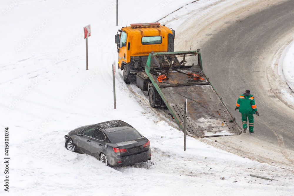Car accident flipped upside down in accident during winter storm. The danger of driving in winter. Attention ice. Studded rubber. Skid car. Road safety flipped upside down accident during. Car accident flipped upside down in accident during winter storm. The danger of driving in winter. Attention ice. Studded rubber. Skid car. Road safety flipped upside down accident during.