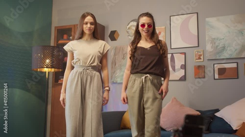 Wallpaper Mural Teenagers womans shooting together dancing at home when making video for social media, stories hip hop popular trandy dance, students at home make content Torontodigital.ca