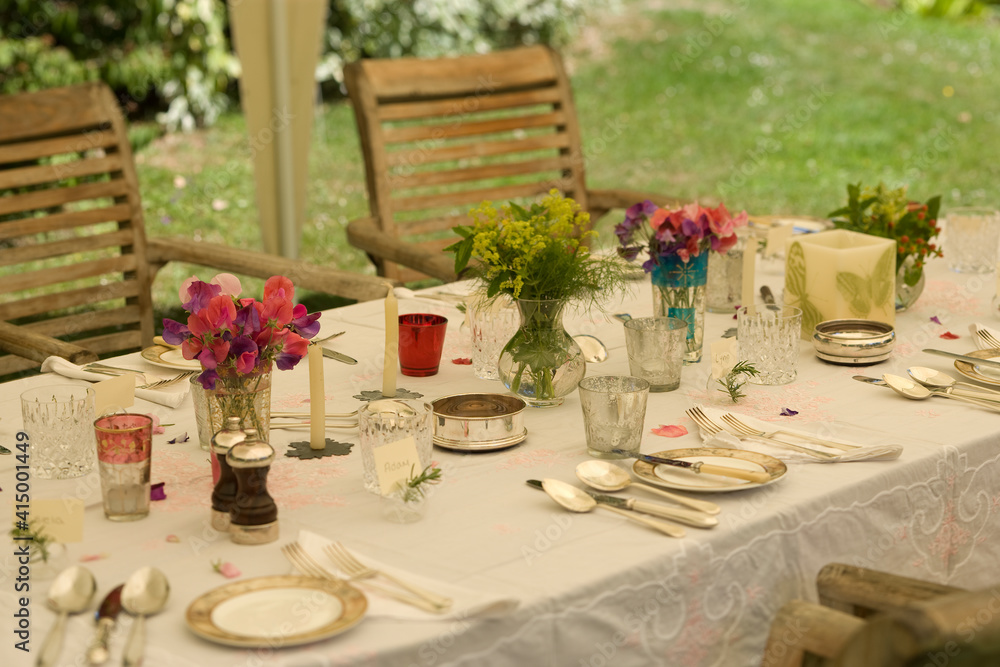 Summer party table, set under canvas marquee, England, UK.