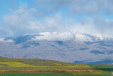 landscape with snow capped mountains and clouds during Winter in Ceres, South Africa 