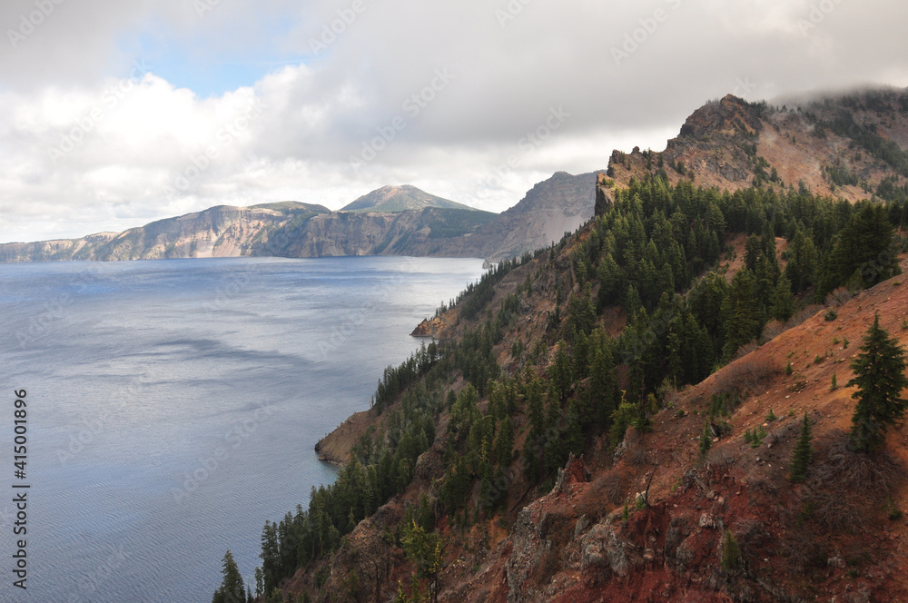 Landscape views of Crater Lake National Park on a cloudy day