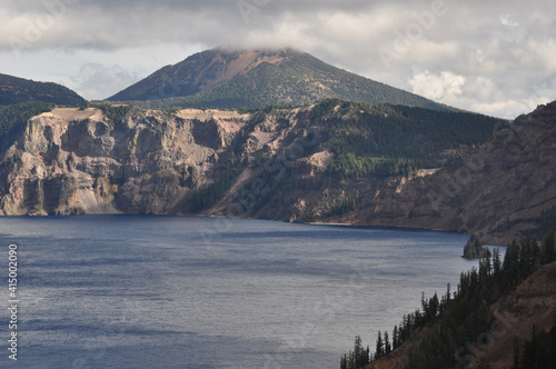 Landscape views of Crater Lake National Park on a cloudy day