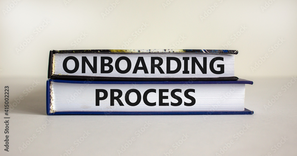 Onboarding process symbol. Books with words 'onboarding process' on beautiful white background. Business and onboarding process concept. Copy space.