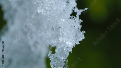 Macro close up photo of frozen snow flake as seen at winter