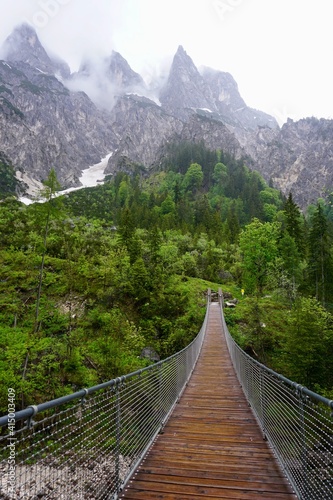 Wooden bridge in the mountains of the Alps