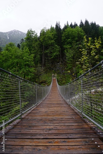 Wooden bridge in the mountains of the Alps