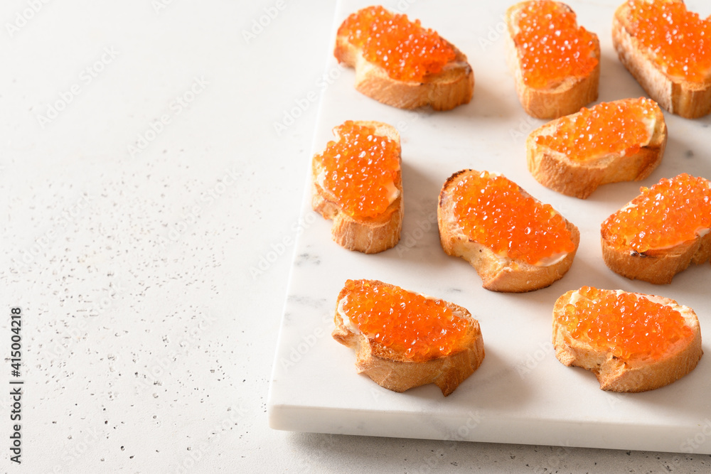 Sandwich with red caviar, tasty appetizer for party. Close up. Sandwich with red caviar, tasty appetizer for party. Close up.