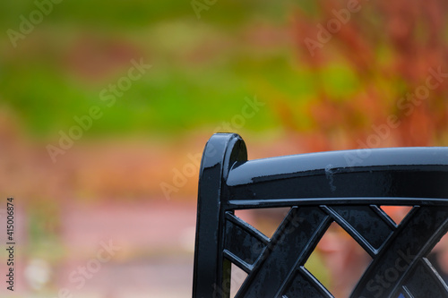 The back of an alumina chair in the deck with lawn in the background.