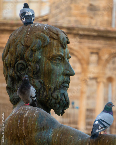 estatua en la plaza de la virgen valencia España, representa el rio Turia valenciano photo