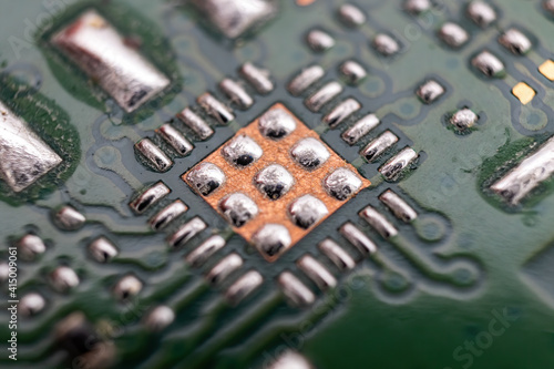 Microchip soldering of an old button mobile phone printed circuit board underside