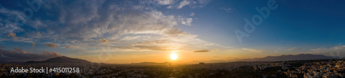 Sunset over Athens, Greece. Aerial drone panoramic view from Penteli mount.