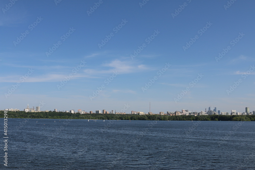 Houses in Strogino on the background of the river, Moscow.