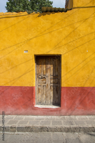 Colorfull door of Mexico, yellow and red. photo