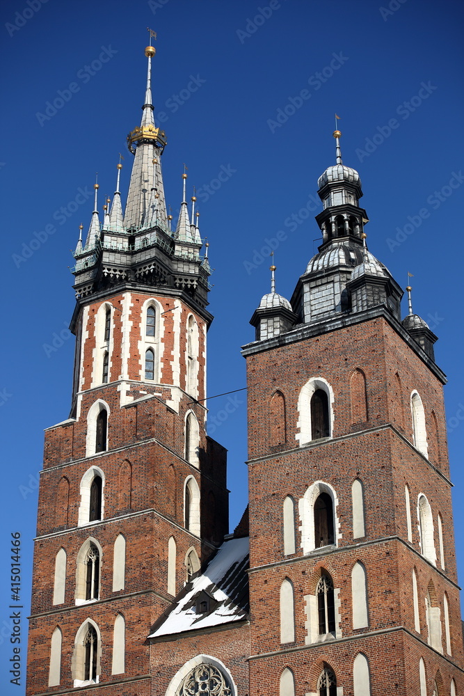 Towers of Saint Marys church in Krakow, Poland, against blue sky