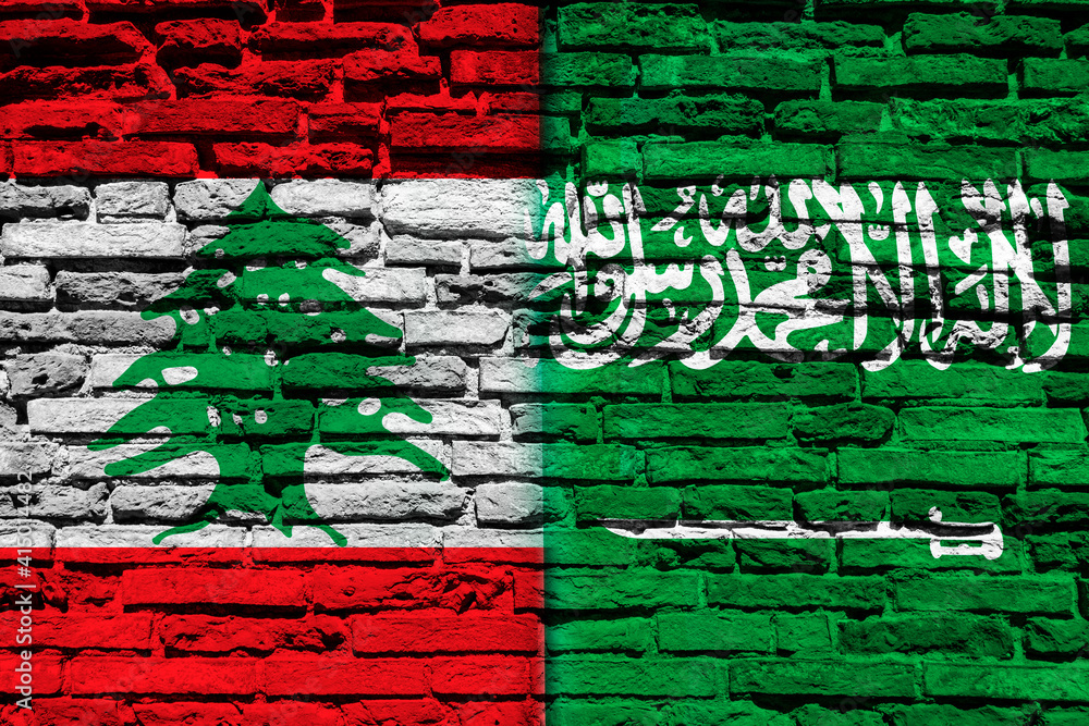 Flag of Lebanon and Saudi Arabia on brick wall