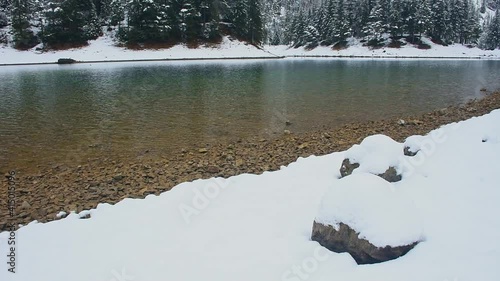 Amazing winter landscape with snowy mountains and clear waters of Green lake (Gruner see), famous tourist destination in Styria region, Austria
