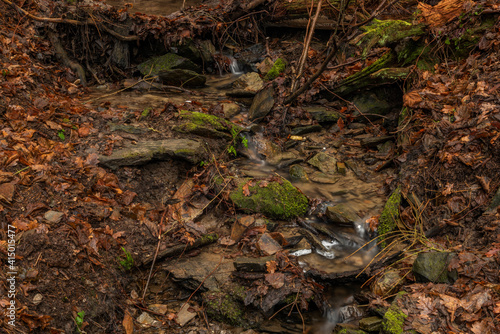 Small creek near Malse river with Doudlebsky waterfall in cold winter color day