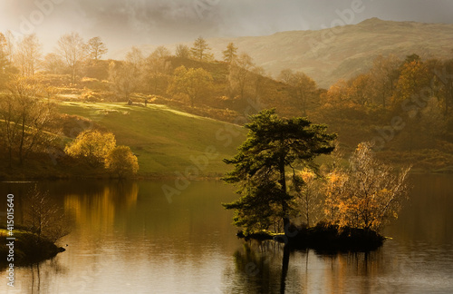 Salnting autumn sunlight over Tarn Howes in Cumbria