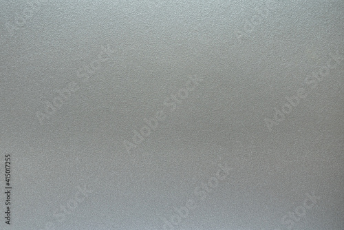 The surface texture of gray metallized plastic, background.