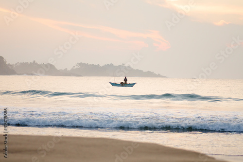 Fisherman on Talalla Beach, Sri Lanka photo