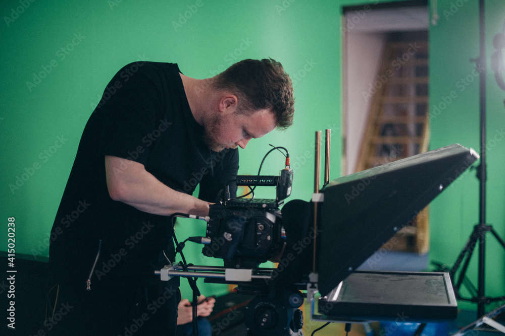 Director of photography with a camera in his hands on the set. Director of photography with a camera in his hands on the set.