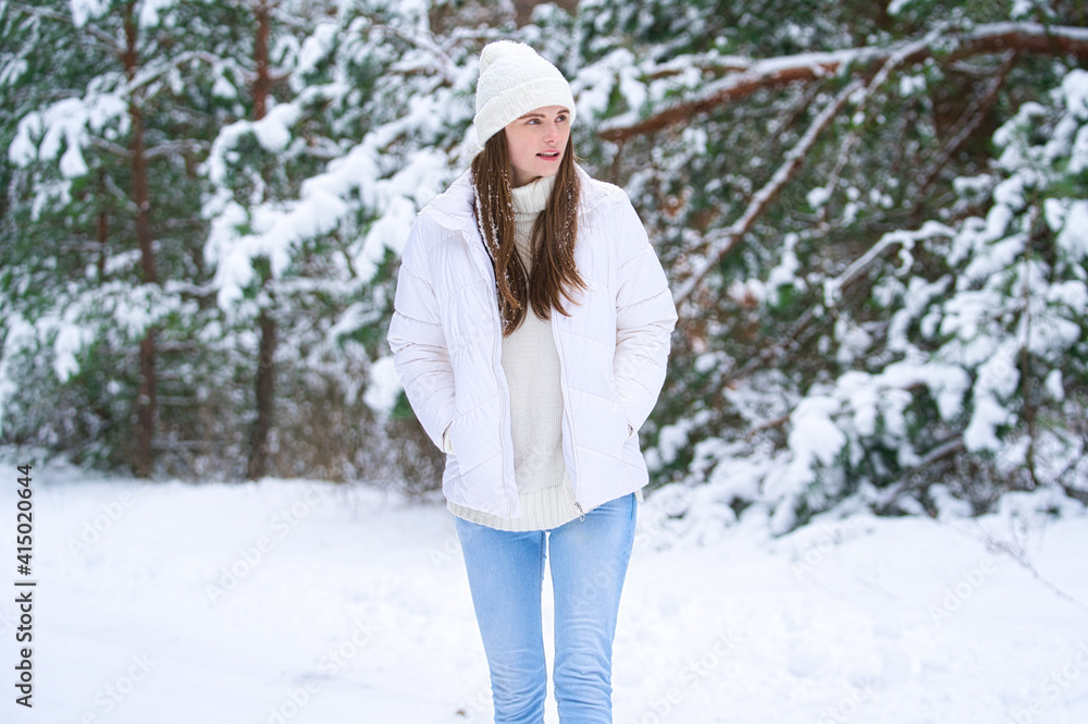 Fototapeta premium beautiful smiling young woman in wintertime outdoor. Winter concept