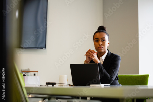 Young businesswoman sales consultant chatting in modern business office photo